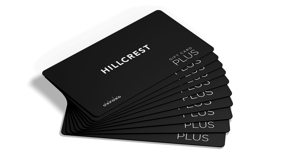 Fanned-out stack of black Hillcrest Plus gift cards on white