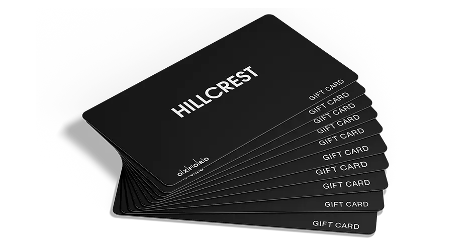Fanned-out stack of black Hillcrest Plus gift cards on white