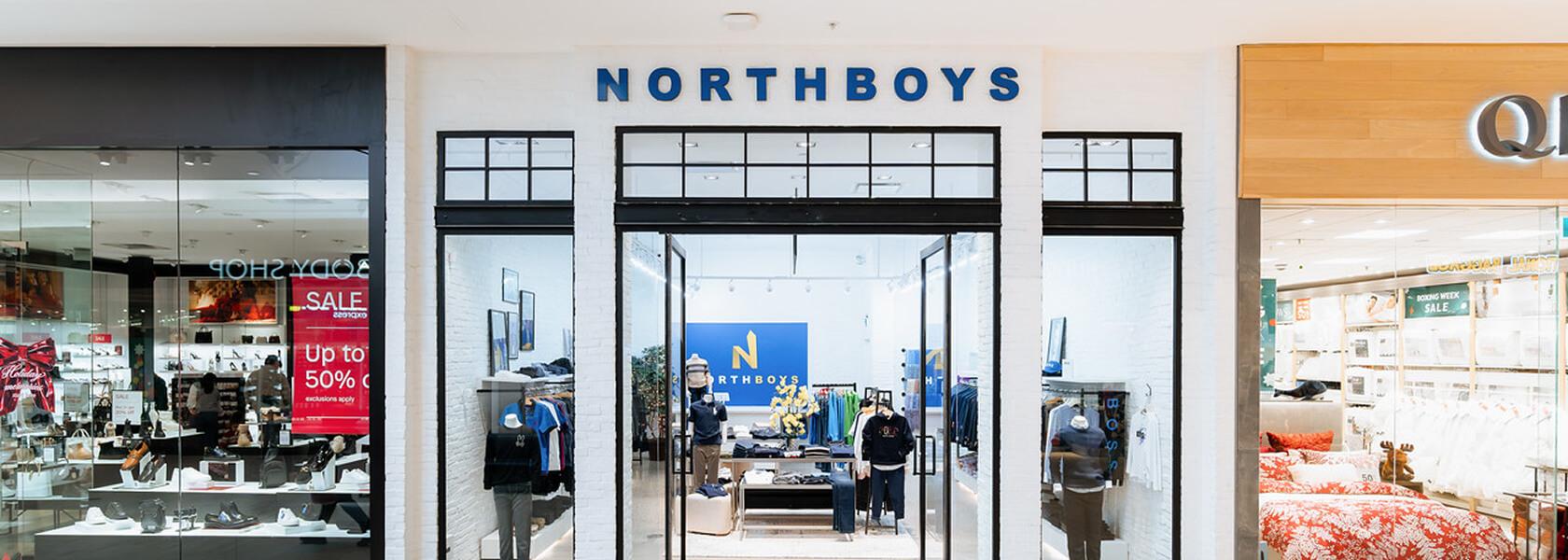 Northboys clothing storefront with white brick facade in a mall