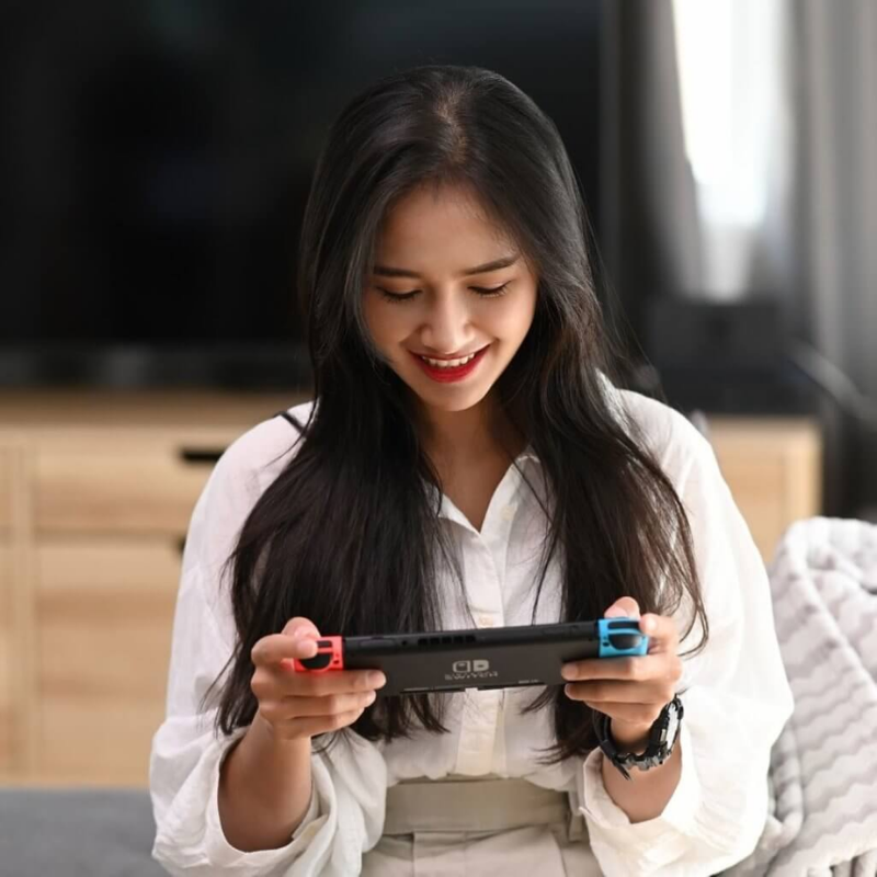 Woman playing Nintendo Switch