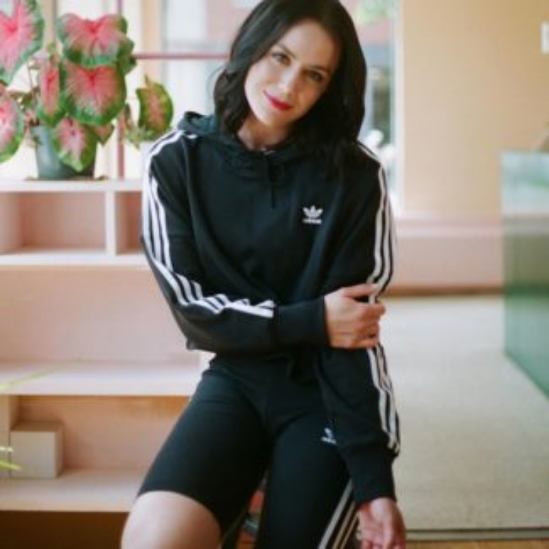Woman in Adidas tracksuit