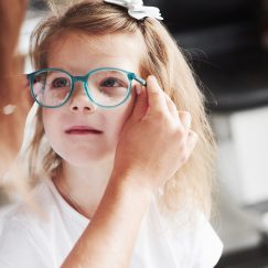 Young girl being fitted for glasses