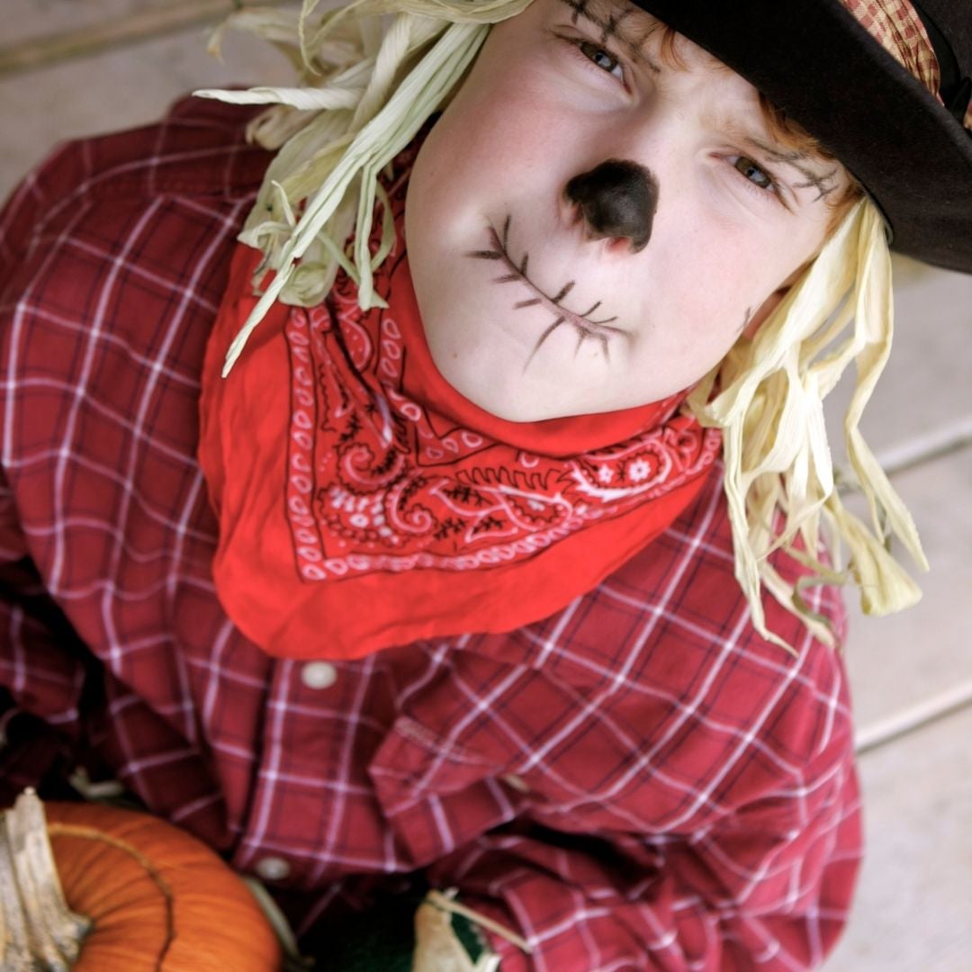 Boy dressed up as a scarecrow