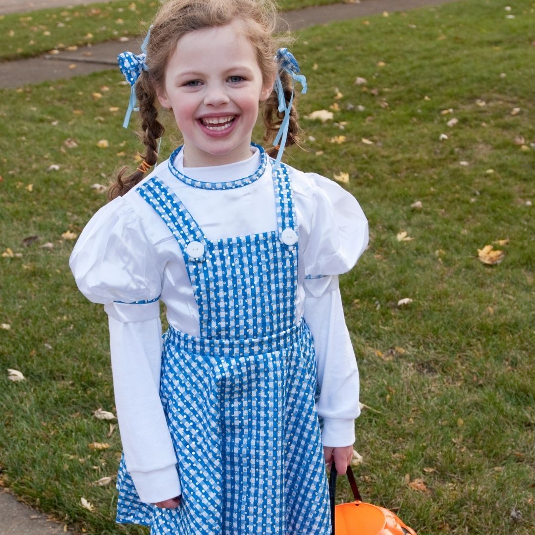 Girl dressed as Dorothy in from Wizard of Oz