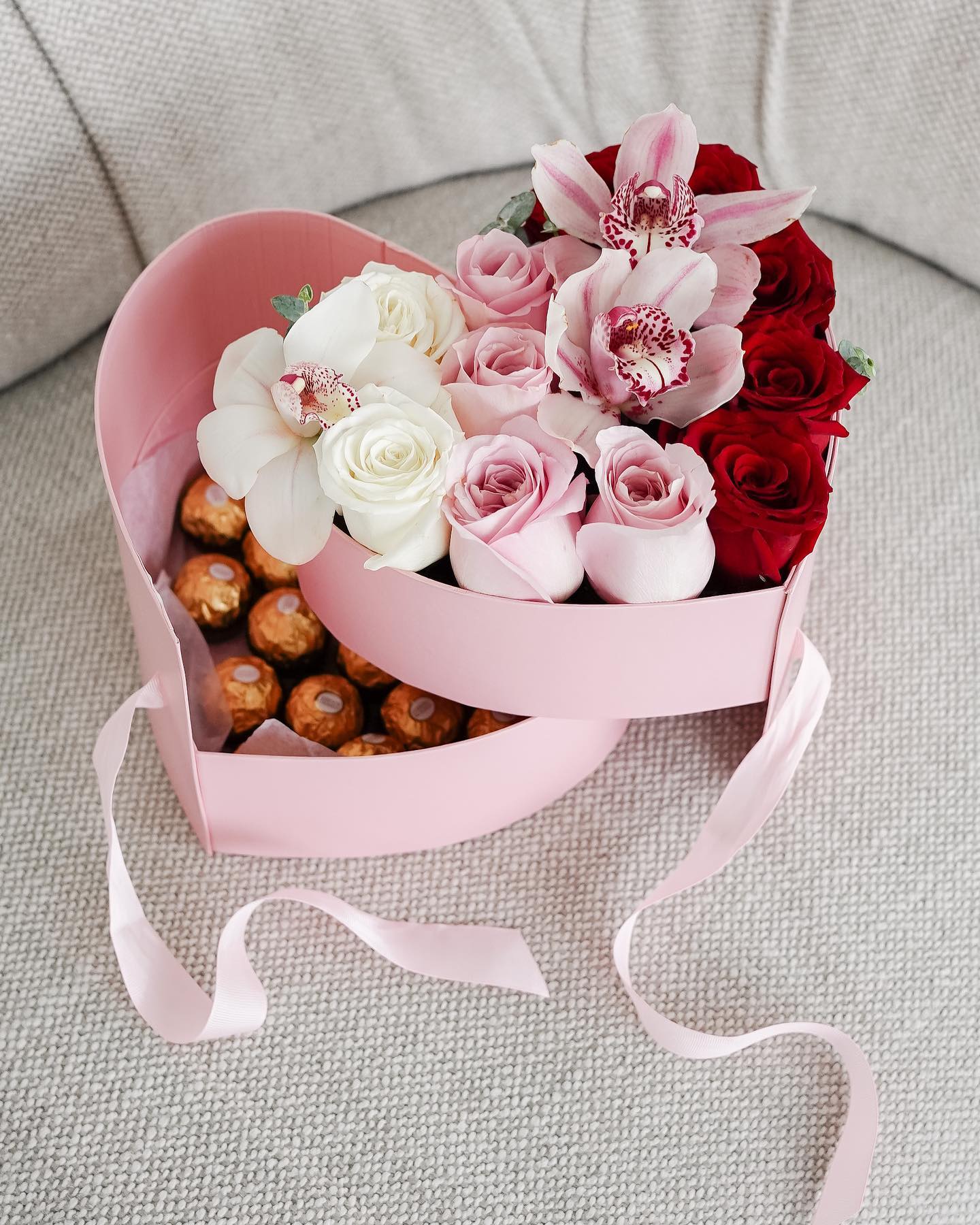 Light pink and red roses in a heart shaped box from Blossom Moments.