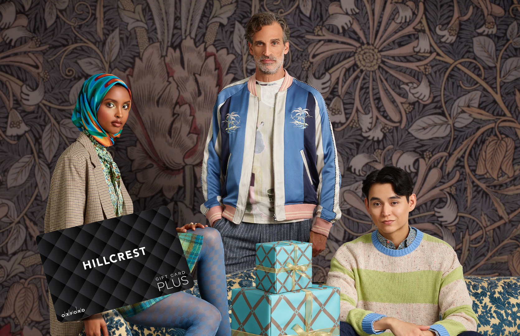 promotional image for Hillcrest gift card featuring three models posing against a printed backdrop