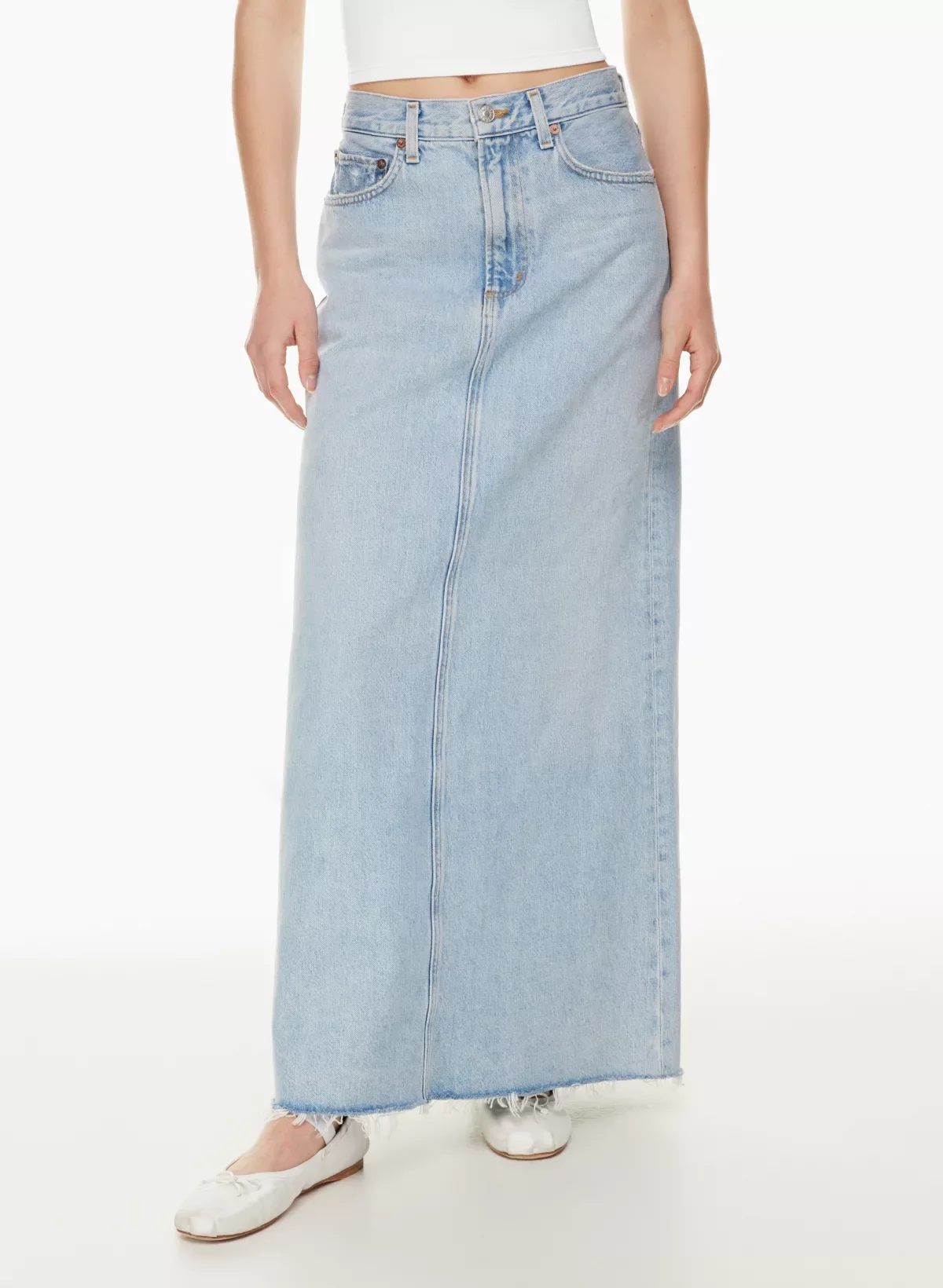 close-up image of a woman wearing a light denim maxi skirt from Aritzia