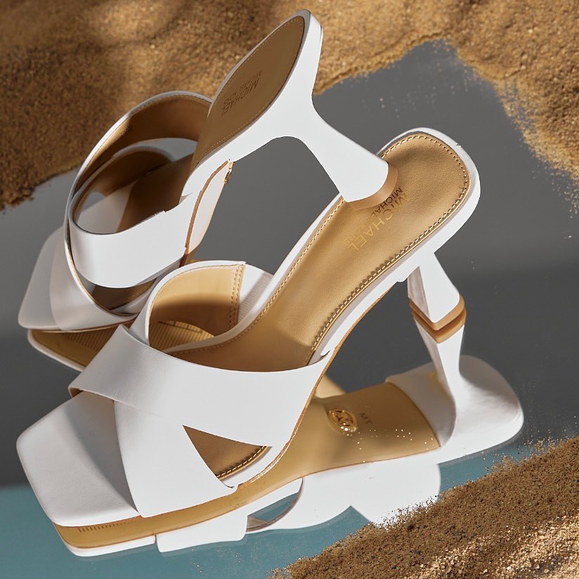 image of a pair of white heeled sandals