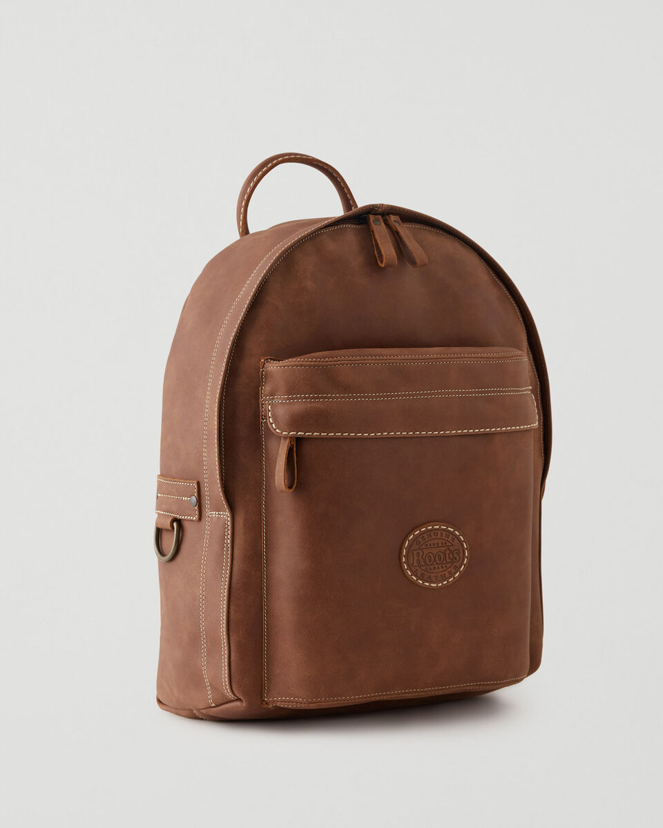 brown leather backpack from roots
