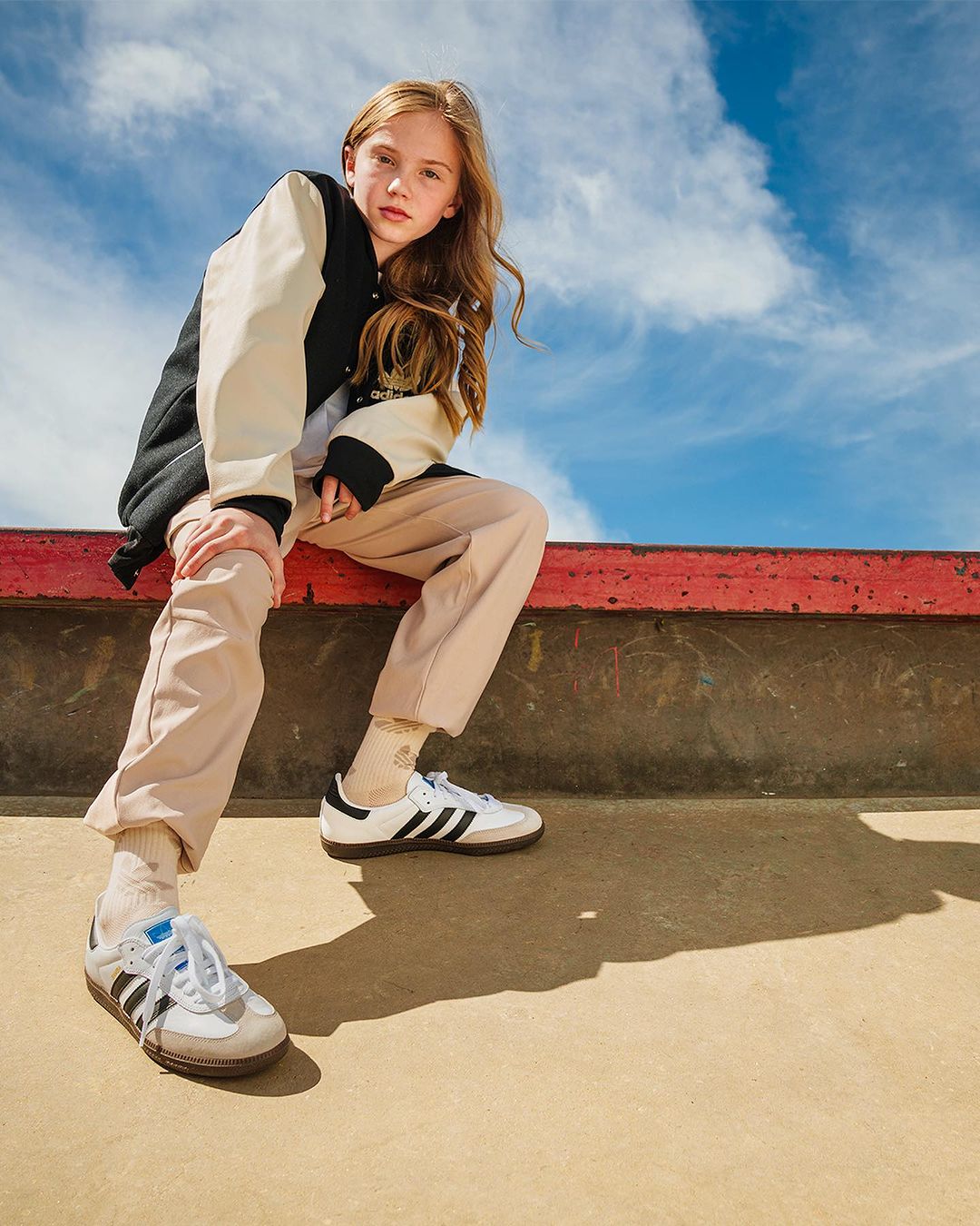 image of a girl sporting athletic wear and adidas samba shoes