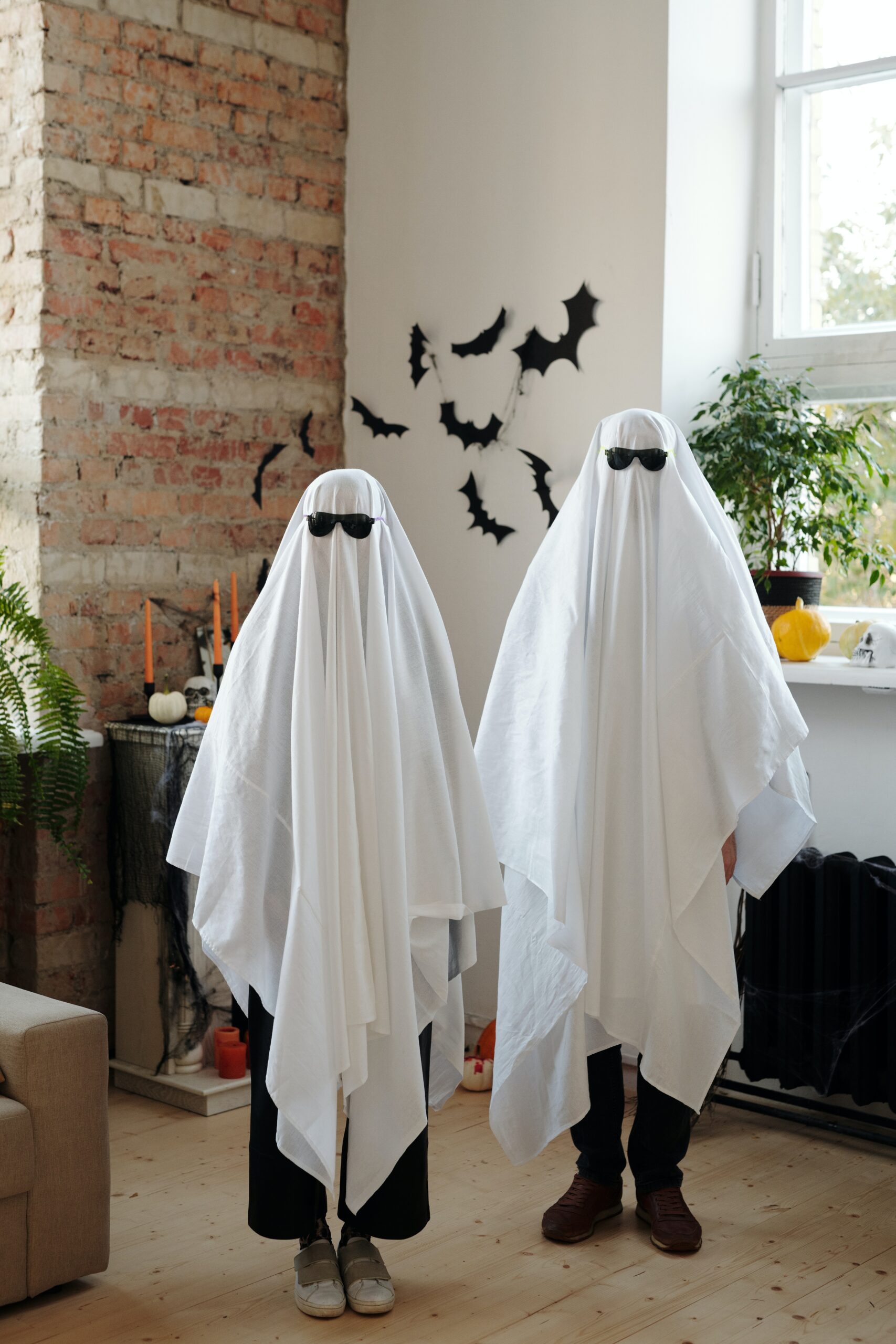 Two people with do-it-yourself ghost costumes.
