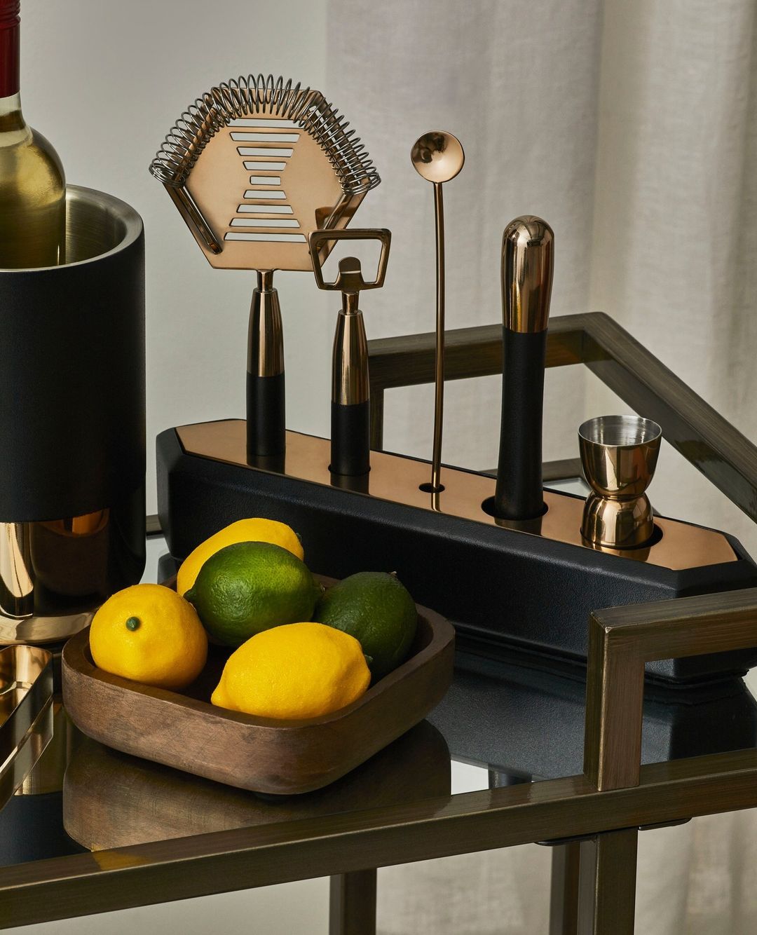 Bar cart styled with bar accessories.