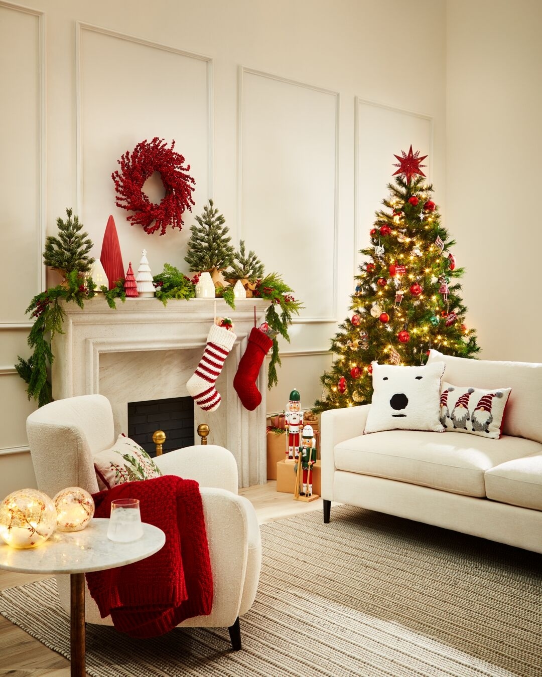 Living room with Christmas tree and other holiday decor.