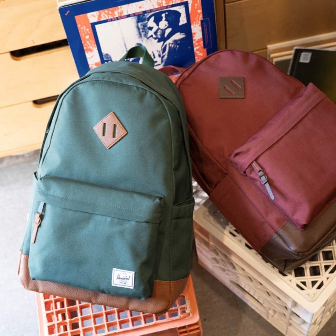 forest green backpack and burnt red backpack from hudson's bay