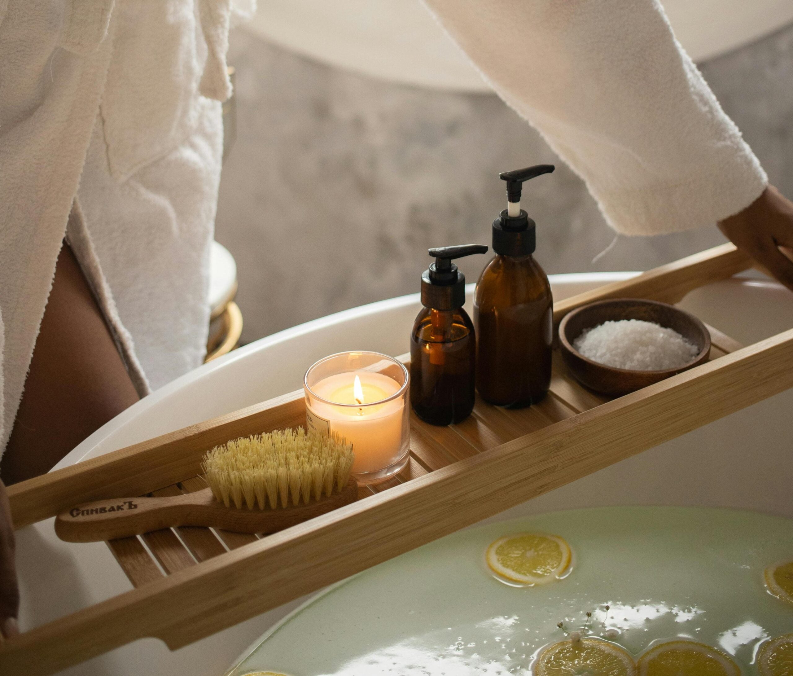 Bath products on a bath holder on top of a bath.